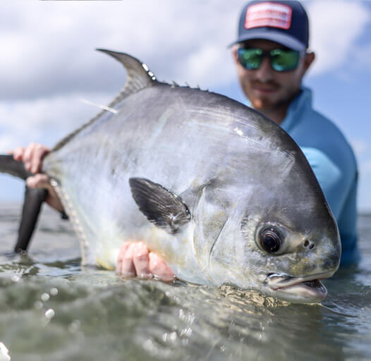 An image of an angler with a permit on board a Outgoing Angling fishing adventure.