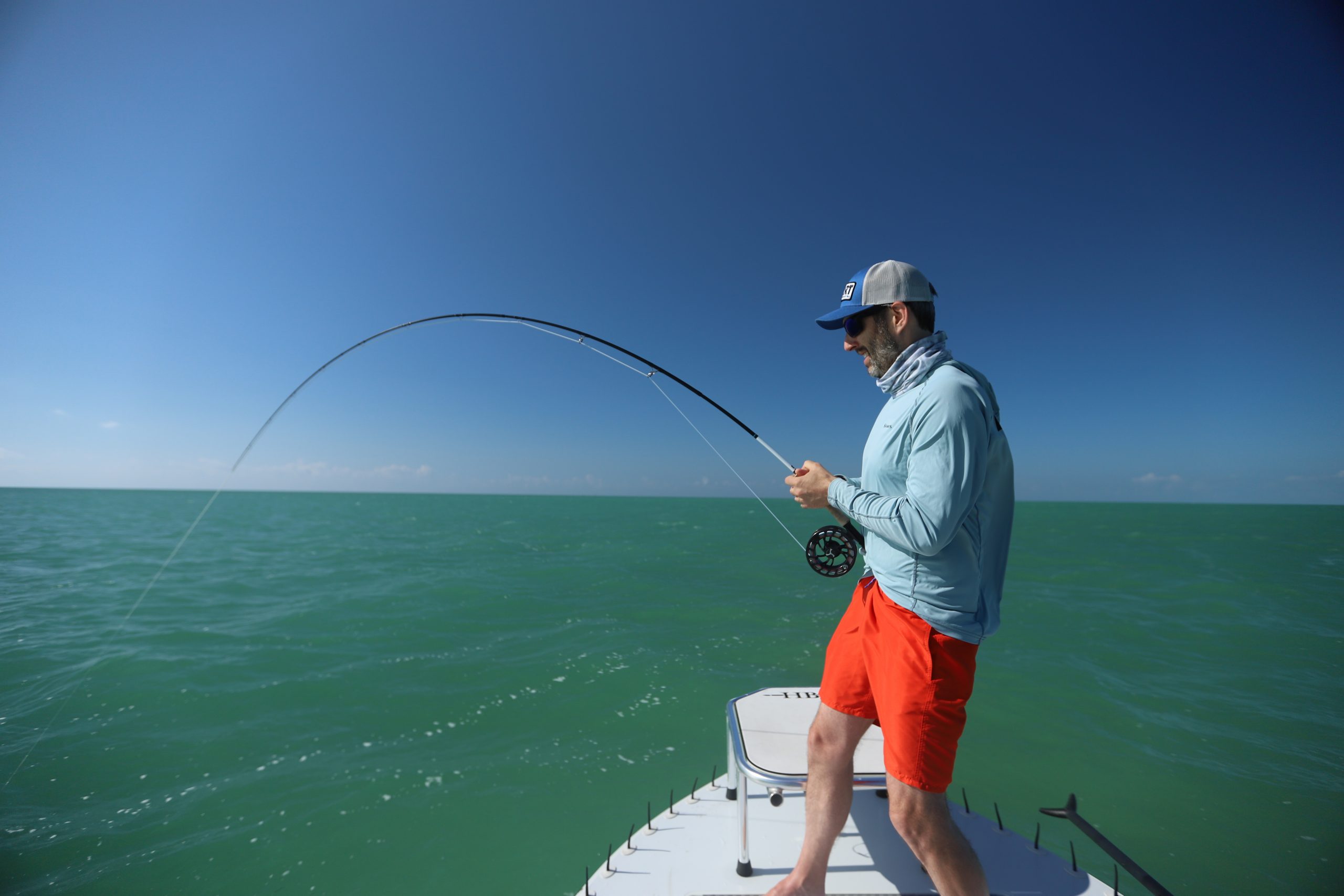 An image of Florida Keys Tarpon rolling under the bridges of the Florida Keys. 