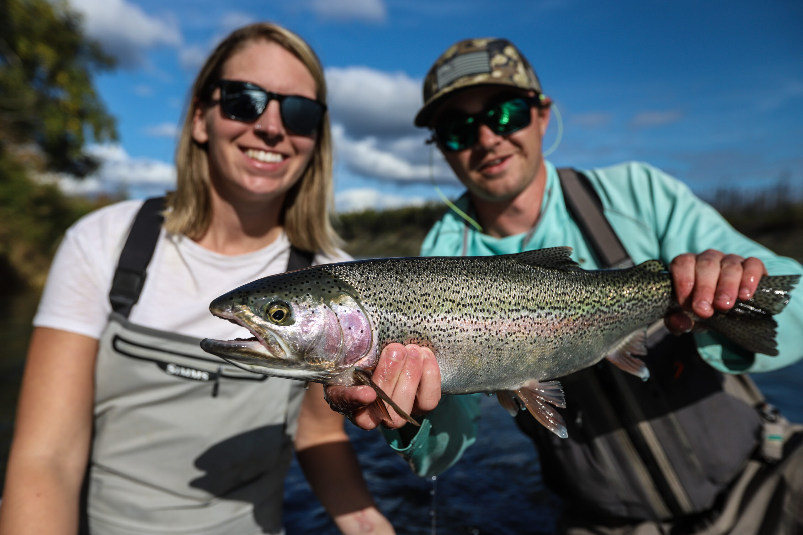 An image of anglers on an Alaska fly Fishing trip with  gorgeous trout.